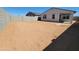 Backyard of home with dirt for new landscaping at 37139 W Prado St, Maricopa, AZ 85138