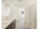 Bathroom with glass shower and double vanity sink at 37139 W Prado St, Maricopa, AZ 85138