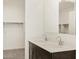 Bathroom with double vanity featuring modern faucets at 37139 W Prado St, Maricopa, AZ 85138
