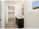 Bathroom featuring double vanity and large walk-in closet at 37139 W Prado St, Maricopa, AZ 85138