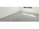 Bright, carpeted bedroom featuring natural light from window at 37139 W Prado St, Maricopa, AZ 85138