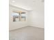 Bright empty bedroom with wood-look floors and large windows providing natural light at 37139 W Prado St, Maricopa, AZ 85138