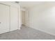 Clean bedroom with sliding-door closet and neutral carpet at 37139 W Prado St, Maricopa, AZ 85138