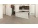 Open floorplan featuring living room and kitchen with tile flooring at 37139 W Prado St, Maricopa, AZ 85138