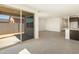 Open living space with kitchen, tile flooring, and sliding doors at 37139 W Prado St, Maricopa, AZ 85138