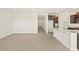 Spacious living room featuring tile flooring and neutral color scheme at 37139 W Prado St, Maricopa, AZ 85138