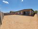 Expansive backyard with potential for landscaping and outdoor living, surrounded by a block fence for privacy at 37154 W La Paz St, Maricopa, AZ 85138