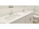 Bright bathroom featuring double vanity sinks with sleek hardware, and modern fixtures at 37154 W La Paz St, Maricopa, AZ 85138