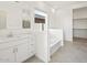 Bright bathroom featuring a double vanity and soaking tub at 37154 W La Paz St, Maricopa, AZ 85138