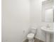 Powder room featuring tile floors, toilet and pedestal sink at 37154 W La Paz St, Maricopa, AZ 85138