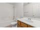 Bright bathroom with a shower-tub combo and a single sink vanity with a wood finish at 3728 W Fremont Rd, Phoenix, AZ 85041