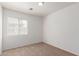 Cozy carpeted bedroom with a window at 3728 W Fremont Rd, Phoenix, AZ 85041