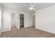 Spacious bedroom featuring a ceiling fan and closet and bathroom access at 3728 W Fremont Rd, Phoenix, AZ 85041