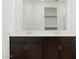 Close-up of a dual sink vanity in a bathroom; a glimpse of a walk-in closet beyond at 37385 W San Sisto Ave, Maricopa, AZ 85138