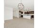 Spacious kitchen with modern stainless steel appliances, dark brown cabinets, and wood-look tile flooring at 37385 W San Sisto Ave, Maricopa, AZ 85138