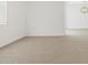 Living room with neutral walls, modern lighting and wood-look tile flooring at 37385 W San Sisto Ave, Maricopa, AZ 85138