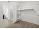 Bright room features a walk-in closet, a shower and a bathroom, showcasing open space at 37385 W San Sisto Ave, Maricopa, AZ 85138