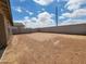 Large private backyard enclosed by a block wall, offering endless possibilities for landscaping and outdoor activities at 37399 W San Sisto Ave, Maricopa, AZ 85138