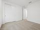 Bright bedroom featuring neutral carpet, white walls, and closet at 37399 W San Sisto Ave, Maricopa, AZ 85138