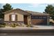 Charming single-story home with stone accents, a two-car garage, and a well-maintained landscaped front yard at 37399 W San Sisto Ave, Maricopa, AZ 85138
