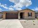Charming single-story home with a well-maintained front yard, desert landscaping, and a two-car garage at 37399 W San Sisto Ave, Maricopa, AZ 85138