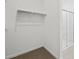 Spacious walk-in closet with ample hanging storage and access to glass-door shower at 37399 W San Sisto Ave, Maricopa, AZ 85138
