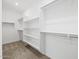 Walk-in closet with shelving, hanging space, and plush carpeting at 37399 W San Sisto Ave, Maricopa, AZ 85138