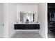 Contemporary bathroom features a double sink vanity and walk-in closet with custom shelving at 3927 E Sheila Ln, Phoenix, AZ 85018