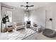 Cozy Bedroom with white walls, a crib, and a comfortable chair and plenty of natural light at 3927 E Sheila Ln, Phoenix, AZ 85018