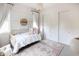 Charming bedroom features a crib, patterned rug, and natural light from large windows at 3927 E Sheila Ln, Phoenix, AZ 85018