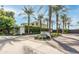 Elegant community entrance with mature palm trees and landscaped signage at 3927 E Sheila Ln, Phoenix, AZ 85018