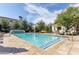 Large community pool with lounge areas, mature trees, and a serene ambiance at 3927 E Sheila Ln, Phoenix, AZ 85018
