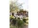 This common area provides an intimate space with chairs, fire pit, and a wooden pergola for residents to enjoy at 3927 E Sheila Ln, Phoenix, AZ 85018