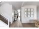 Spacious foyer with hardwood floors, staircase, and gallery wall at 3927 E Sheila Ln, Phoenix, AZ 85018