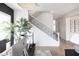 Staircase with hardwood floors and metal railing and view into an office at 3927 E Sheila Ln, Phoenix, AZ 85018