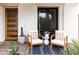 Cozy front porch with chairs, cactus and pavers at 3927 E Sheila Ln, Phoenix, AZ 85018