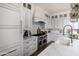 The kitchen features white cabinetry, marble countertops and backsplash, and stainless steel appliances at 3927 E Sheila Ln, Phoenix, AZ 85018
