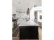 Bright kitchen features a large island, marble countertops and backsplash, and stainless steel appliances at 3927 E Sheila Ln, Phoenix, AZ 85018