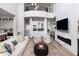 Open concept living space with high ceilings, fireplace, and modern decor at 3927 E Sheila Ln, Phoenix, AZ 85018