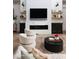 Cozy living room with fireplace, modern decor, and ample natural light at 3927 E Sheila Ln, Phoenix, AZ 85018