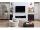 Cozy living room features a fireplace, built-in shelves, and comfortable seating at 3927 E Sheila Ln, Phoenix, AZ 85018