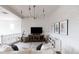 Bright loft area with floral wallpaper, modern chandelier, TV, and comfortable seating at 3927 E Sheila Ln, Phoenix, AZ 85018