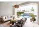 Comfortable outdoor living space overlooking the pool and lush landscaping at 3927 E Sheila Ln, Phoenix, AZ 85018