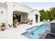Beautiful backyard oasis featuring a sparkling pool and spa, complemented by a covered patio at 3927 E Sheila Ln, Phoenix, AZ 85018