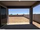 Covered back patio view of the block-fenced yard at 4521 S 95Th Dr, Tolleson, AZ 85353