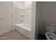 Bathroom showcasing a shower and bathtub with white fixtures and a toilet at 4521 S 95Th Dr, Tolleson, AZ 85353