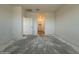 View of the bedroom with open closet and doorway to the en suite bathroom at 4521 S 95Th Dr, Tolleson, AZ 85353