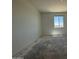 Empty bedroom shows neutral walls and window for light and ventilation at 4521 S 95Th Dr, Tolleson, AZ 85353