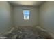Bright bedroom with a window offering natural light and blank canvas flooring at 4521 S 95Th Dr, Tolleson, AZ 85353