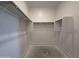 Walk-in closet with shelving and metal hanging rods at 4521 S 95Th Dr, Tolleson, AZ 85353